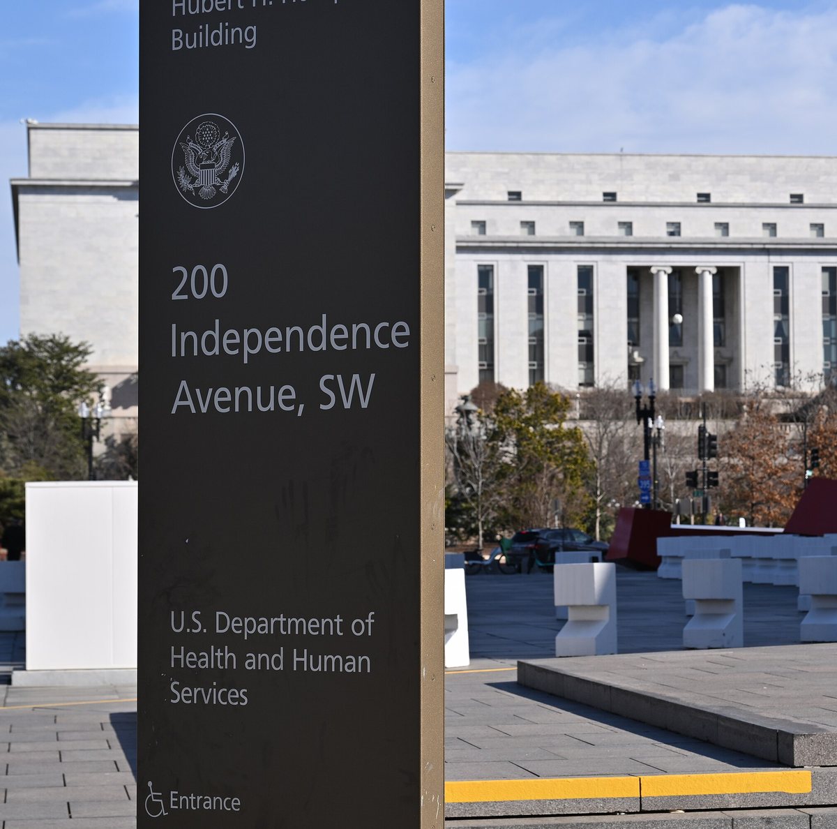 TANF government shutdown detail photo focused on the HHS headquarters entrance sign
